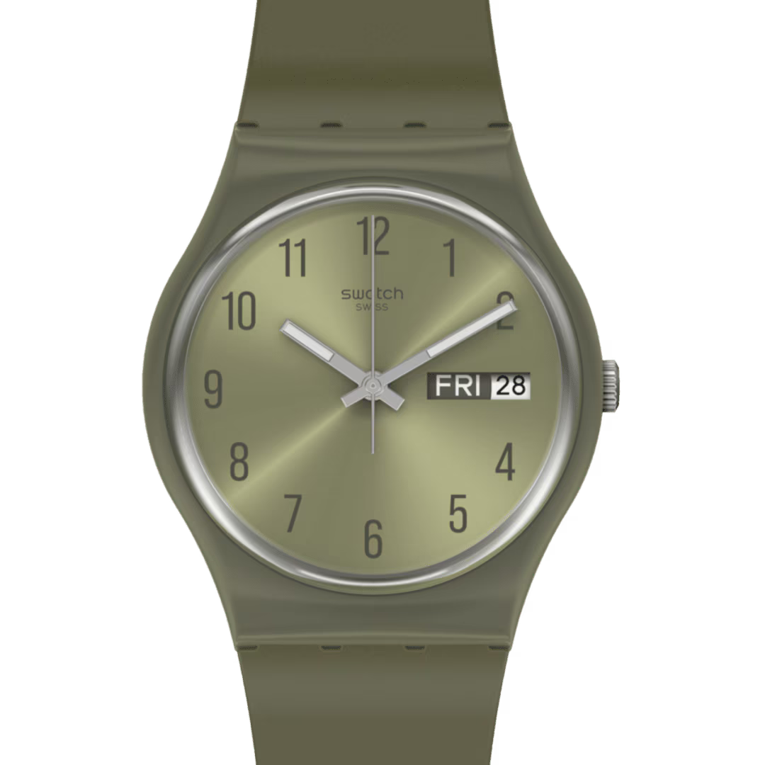 Dettaglio del quadrante verde Swatch PEARLYGREEN GG712 con numeri arabi e finestrella del giorno e della data.
