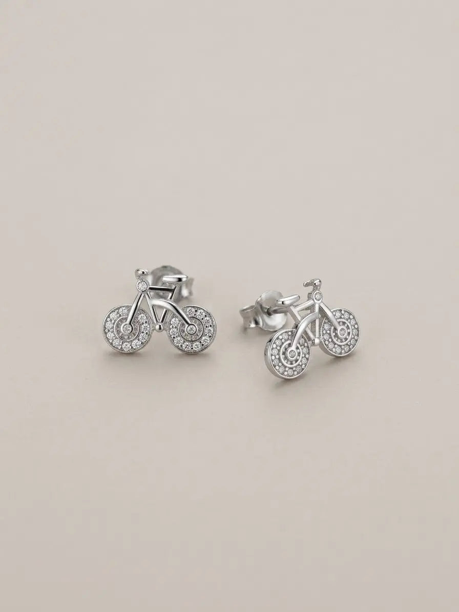 Orecchini a bicicletta CICCO925 OR0115 in argento 925 con zirconi sulle ruote, su sfondo neutro, CICCO Gioielleria.