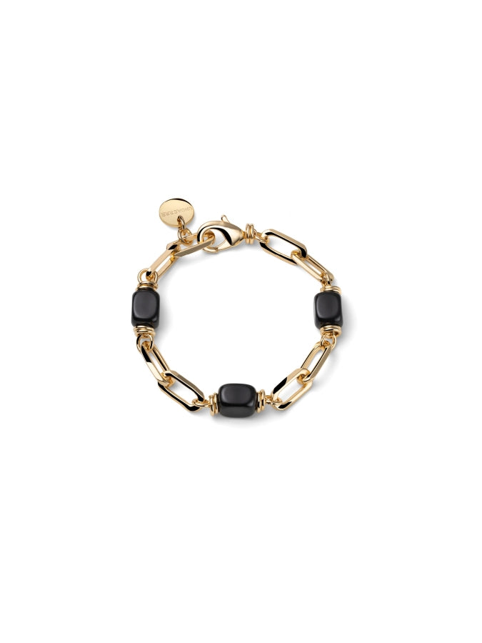 Bracciale UNOAERRE Joya con catena dorata e cubetti di onice su sfondo neutro – CICCO Gioielleria